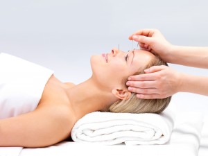 bigstock_acupuncture_on_a_beautiful_wom_6228540